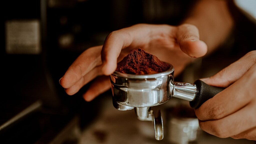 Barista crafting quality coffee at Cafe C&M — your go-to coffeeshop near me.