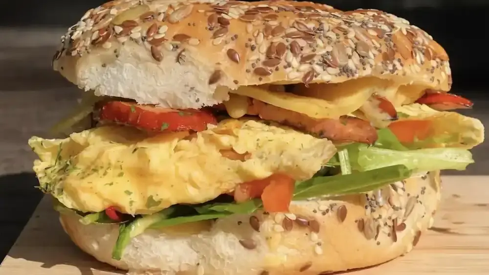Best Bondi bagels - Chunky Egg Bagel filled with scrambled egg, melted cheese, crispy bacon and fresh vegetables